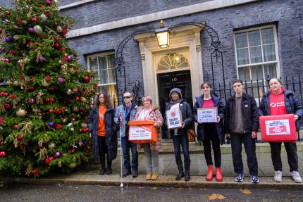Campaigners outside 10 Downing Street holding petition boxes